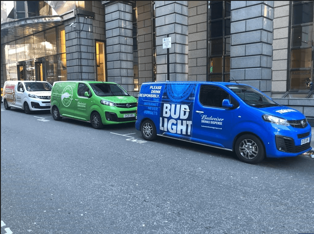 Branded vans on a street 